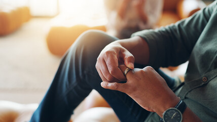 man taking off engagement ring